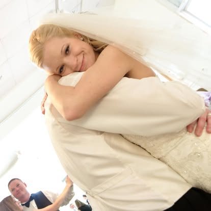 Bride hugging a loved one after the ceremony