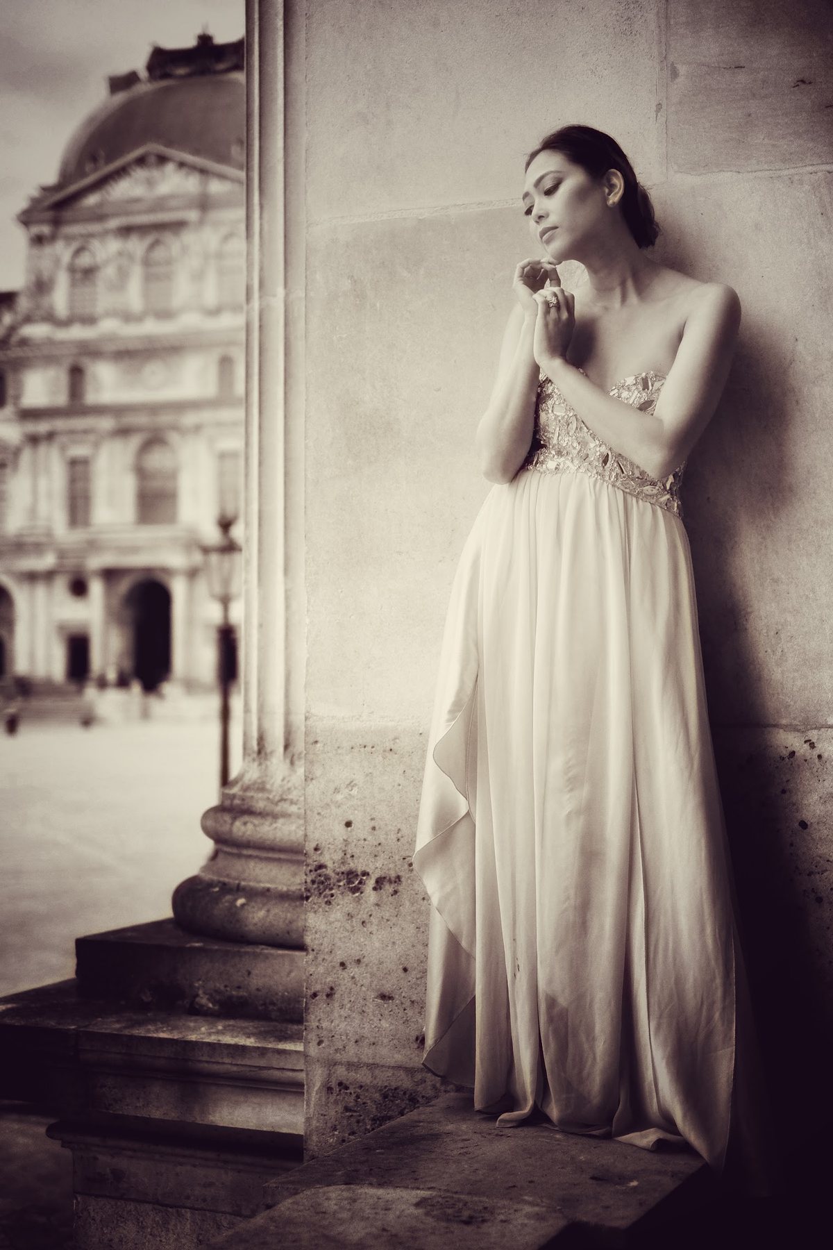 Editorial bridal portrait beside classical architecture
