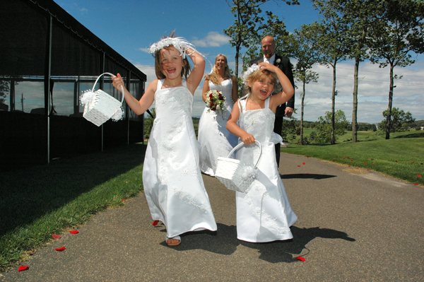 Flower girls running joyfully outdoors