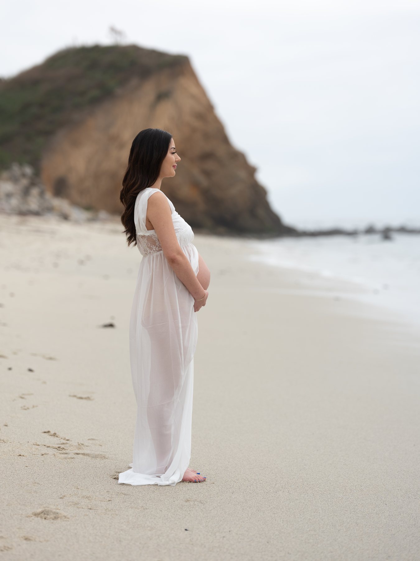 Maternity portrait on a quiet beach