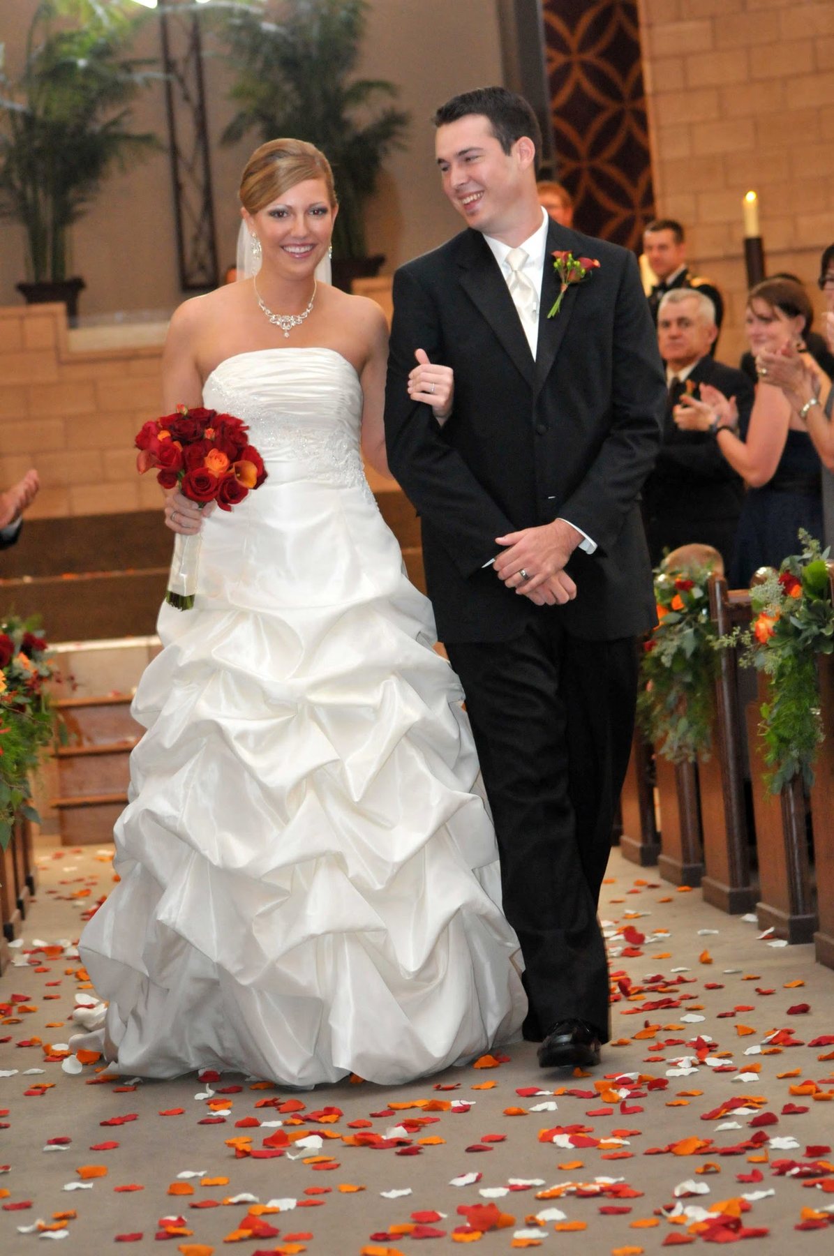 Newlyweds leaving their ceremony together