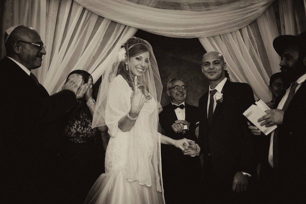 Newlyweds celebrating beneath the wedding canopy