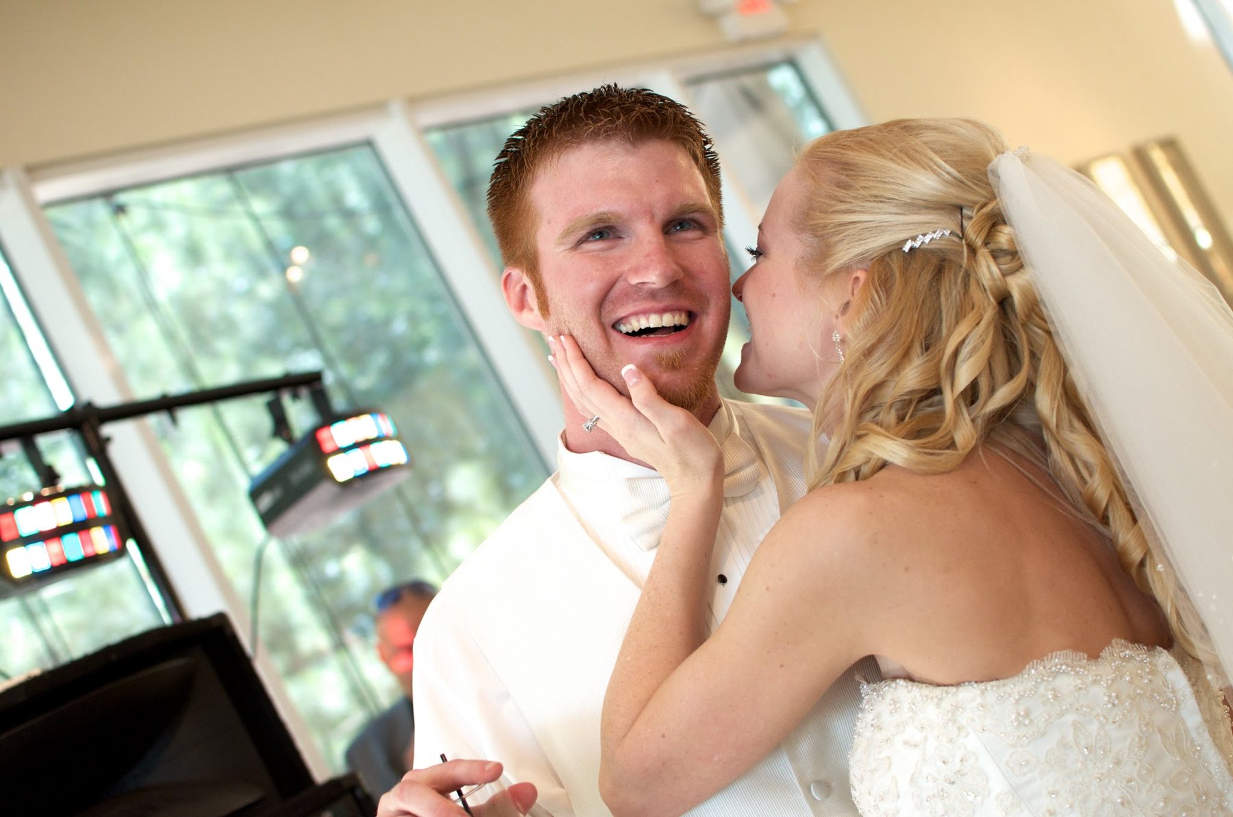Bride sharing a joyful candid moment with the groom