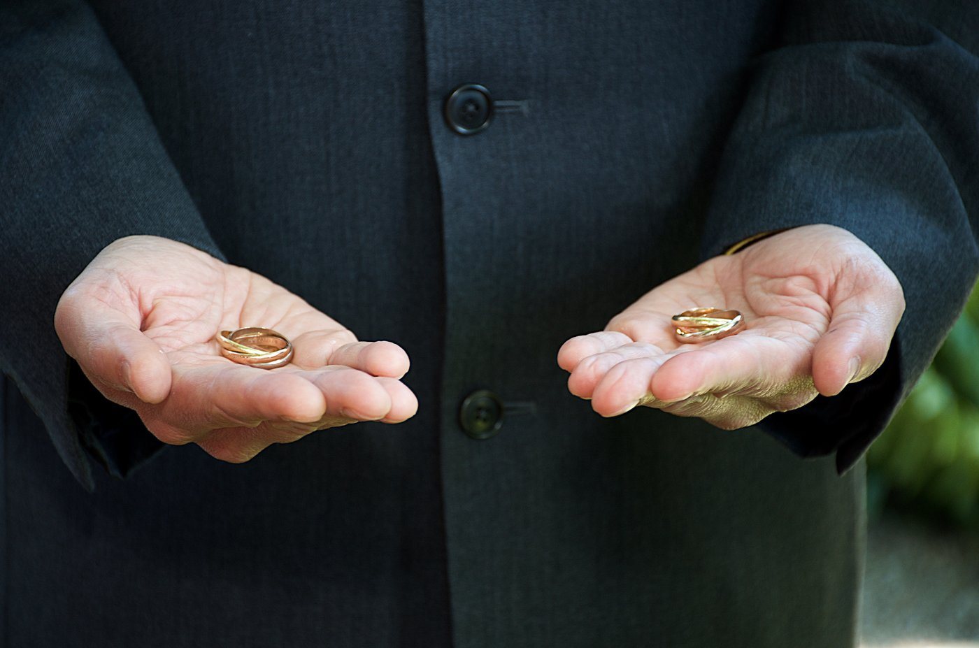 Wedding rings displayed in open hands